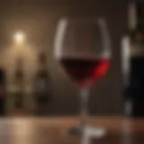 A glass of red wine with a blurred background representing health concerns