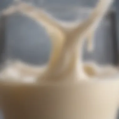 Close-up of raw milk in a glass with rich cream layer